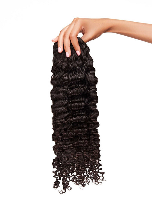 HAND HOLDING HEAT FREE HAIR FOR KOILS WEFTED HAIR